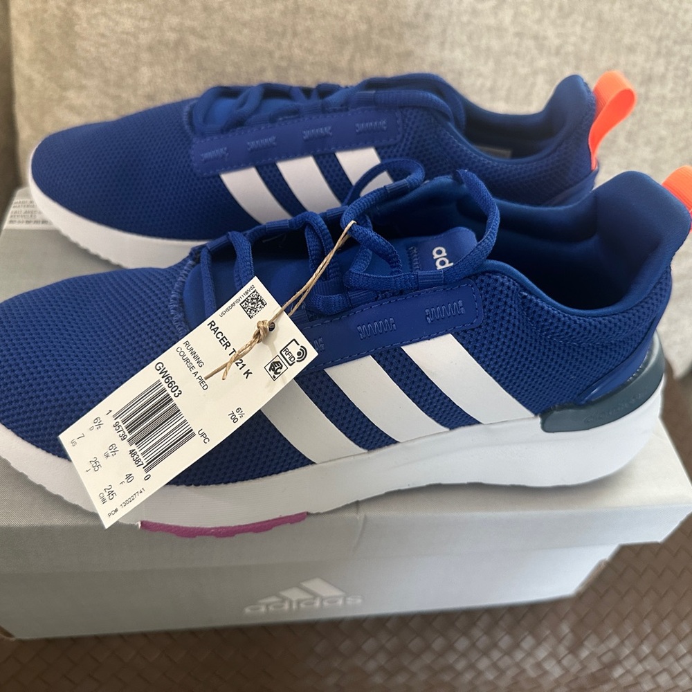 Never Worn! Adidas tennis shoes.